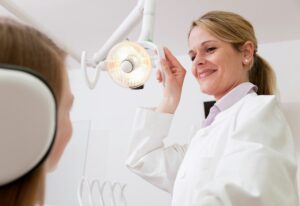 Dentist with patient in surgery