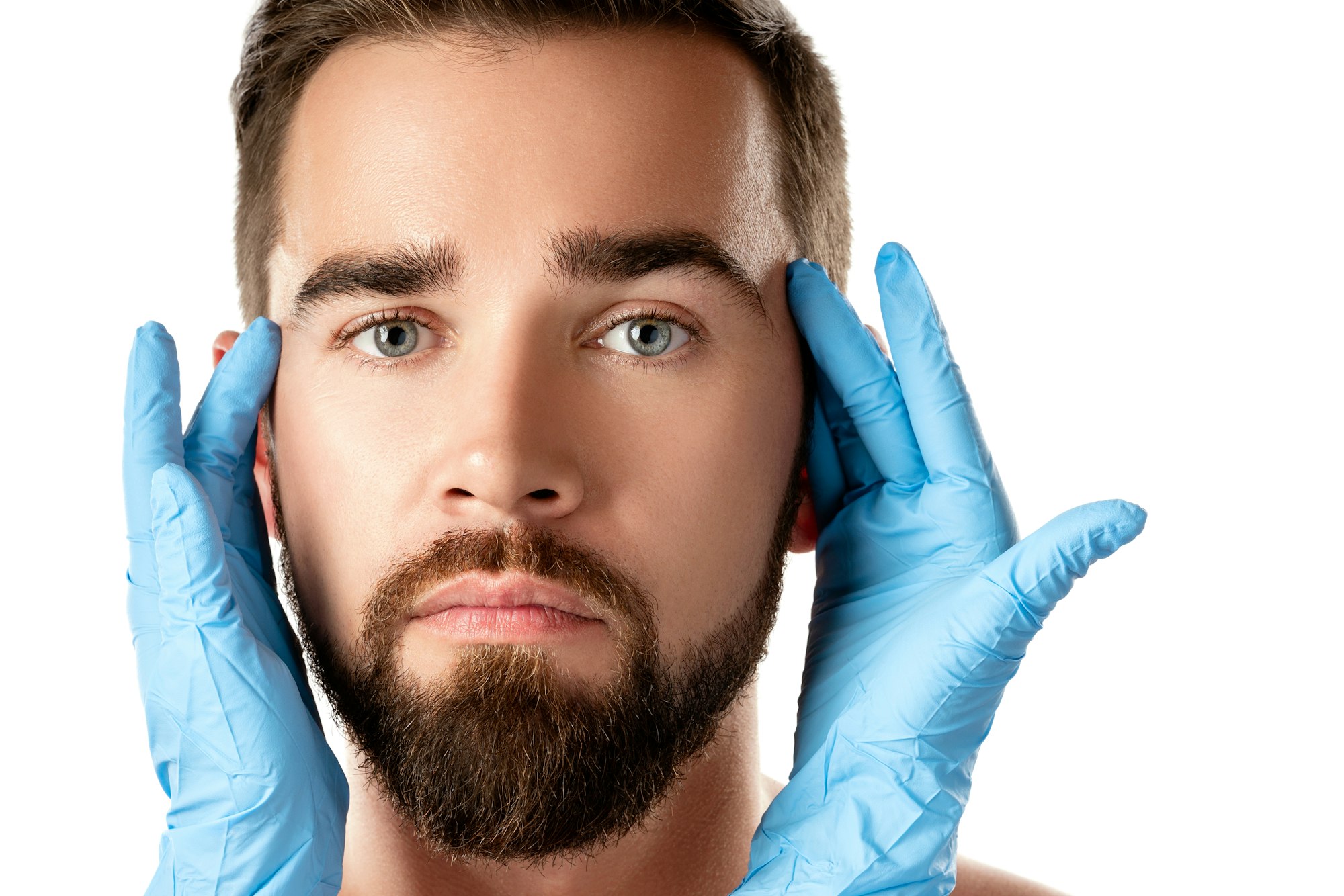 Handsome man during check-up before a plastic surgery